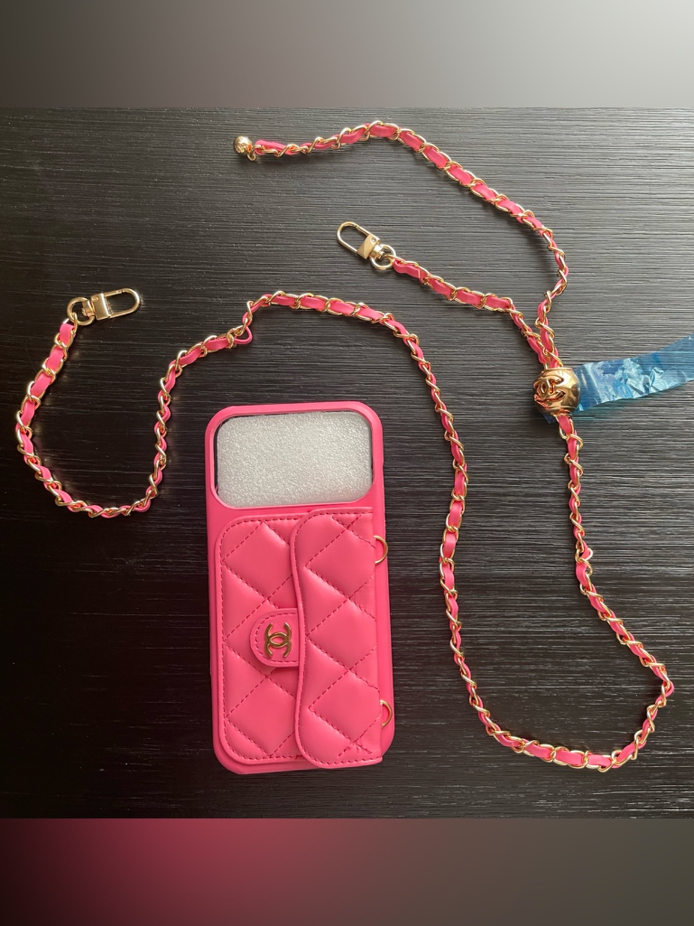 iPhone 17 Pro Max Pink Quilted Phone Case with Gold Chain Strap.